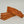 Load image into Gallery viewer, Four rectangular pieces of spicy meat jerky are stacked on a light surface, with one piece leaning diagonally on top. The jerky has a reddish-brown color with visible seasoning specks.