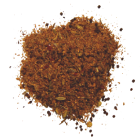 A small pile of brown, finely ground spice mix with visible flecks of herbs and seeds, scattered on a white background.
