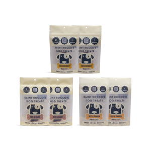 Three packages of Saint Rocco's Dog Treats on a white background