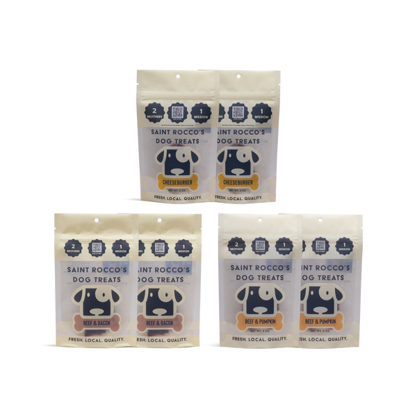 Three packages of Saint Rocco's Dog Treats on a white background