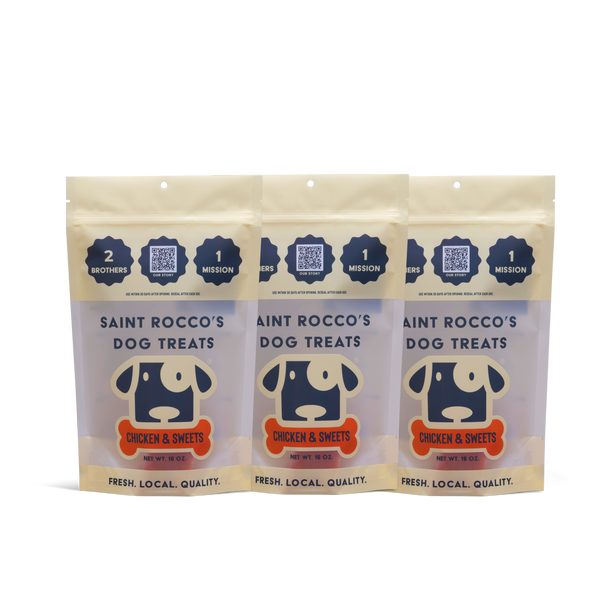 Three packages of Saint Rocco's Dog Treats on a white background