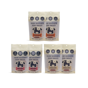 Four packages of Saint Rocco's Dog Treats, meat lover, chicken & sweets, and chicken and honey on a white background