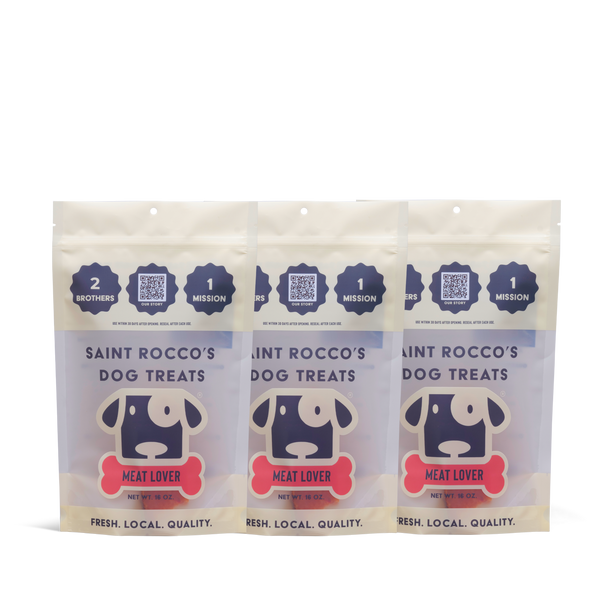Three packages of Saint Rocco's Dog Treats on a white background