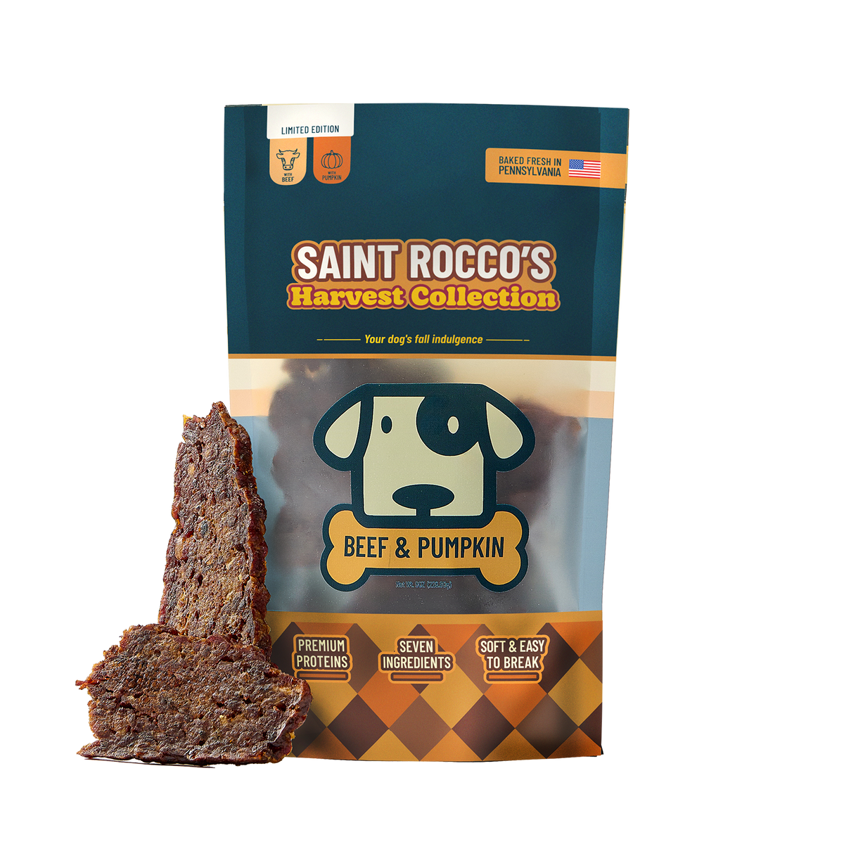 A bag of Saint Rocco's Harvest Collection Beef & Pumpkin dog treats stands on a white background with two pieces of the treat leaning against the lower left of the package. The bag is dark teal and brown with a cartoon dog head logo and text highlighting limited edition pumpkin beef treats.