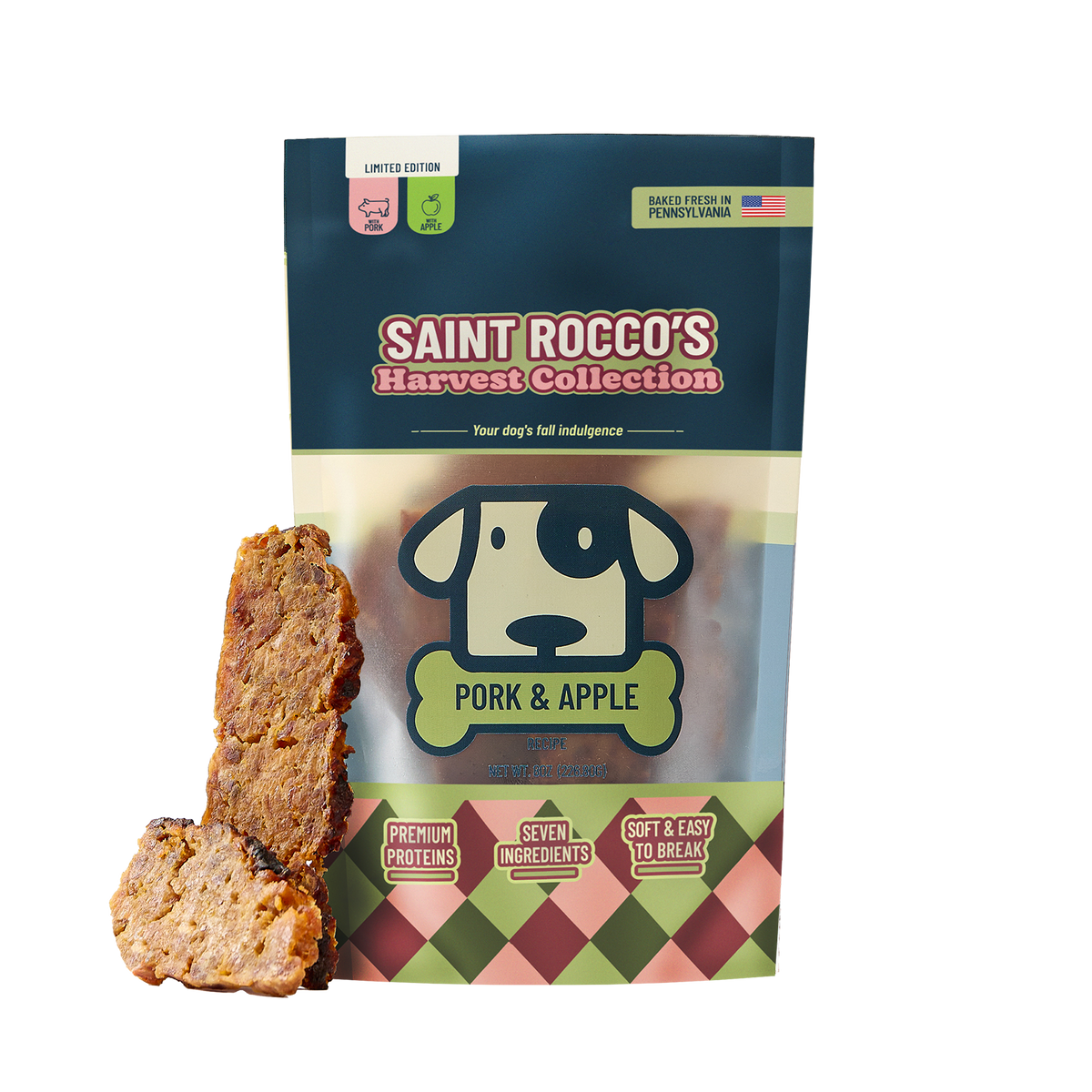 A stand-up pouch of Saint Rocco's Harvest Collection Pork & Apple dog treats, shown with two sliced treats leaning against the left side on a plain white background.
