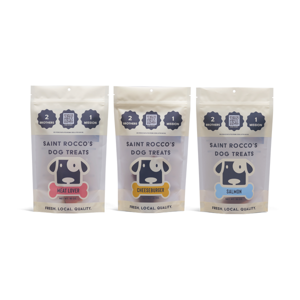 Three packages of Saint Rocco's Dog Treats on a white background