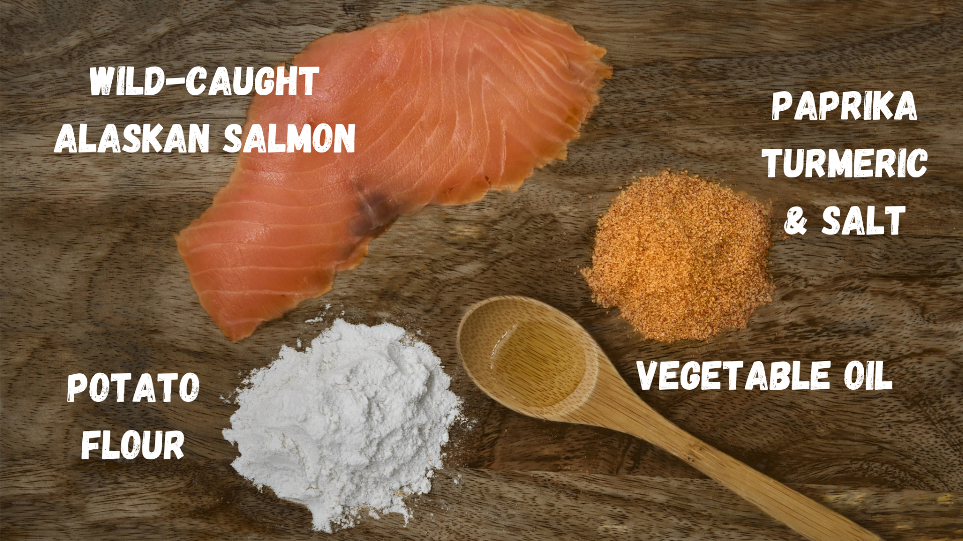 A slice of wild-caught Alaskan salmon, potato flour, vegetable oil, and a paprika-turmeric-salt mix are arranged with labels, showcasing Saint Rocco's Treats Seafood Treats Sampler Bundle for homemade dog treats or a seafood sampler.