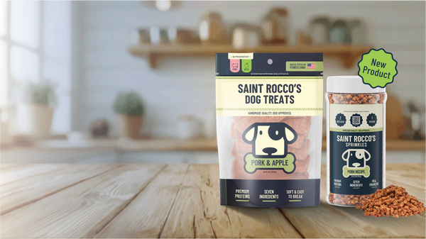 Saint Rocco's dog treats packaging on a wooden surface with a blurred kitchen background
