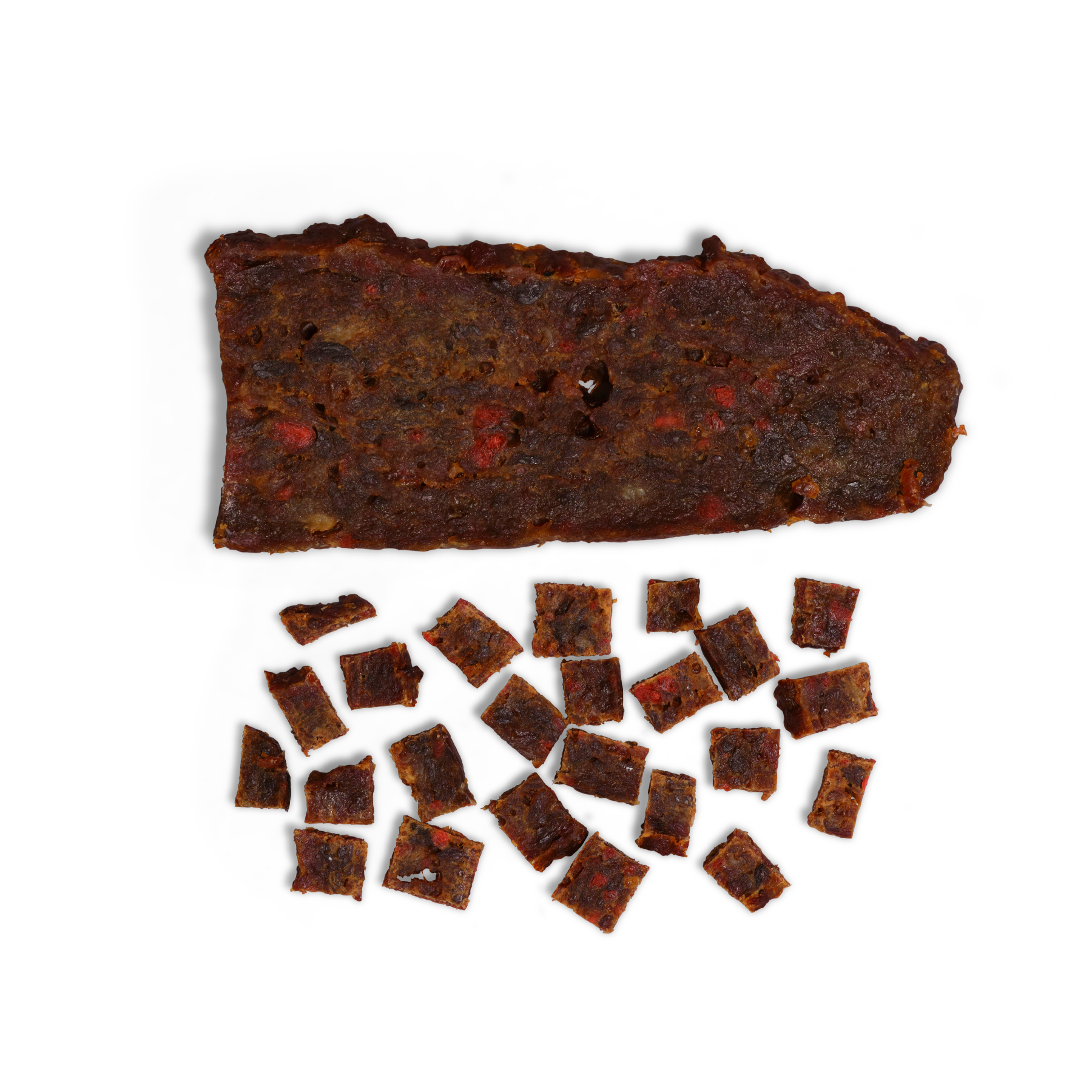 A large piece of Saint Rocco's Treats Beef and Bacon Treats sits above bite-sized squares of the same jerky, all neatly arranged on a white background—ideal high-value rewards for your pup.