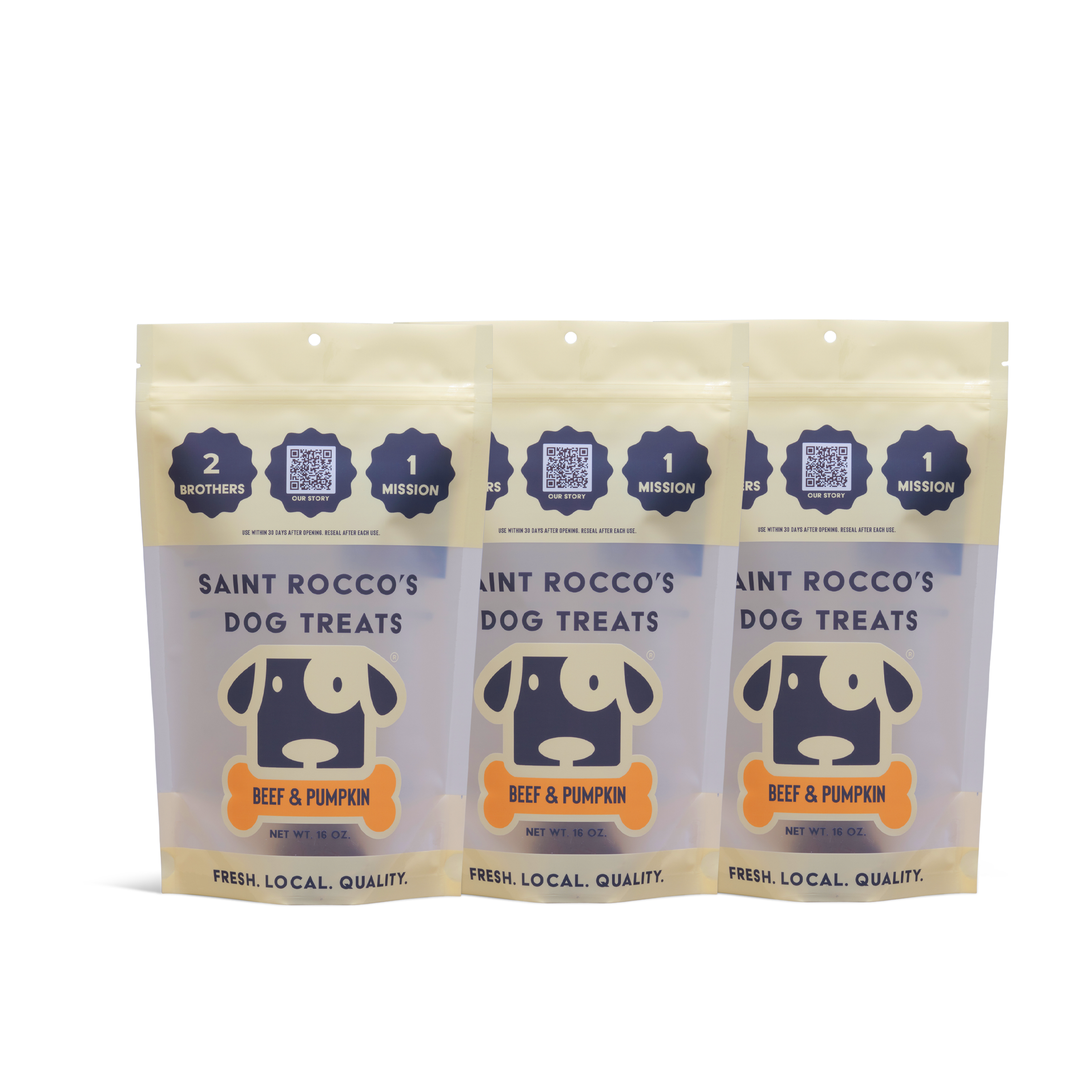Three beige and lavender standing pouches of Saint Rocco’s Treats Beef and Pumpkin Treats display a cartoon dog, QR codes, and messaging focused on quality and mission.