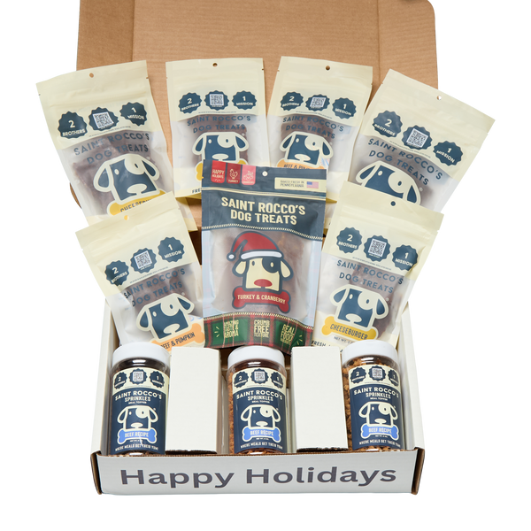 Box of Saint Rocco's Dog Treats with various flavors and a 'Happy Holidays' message.