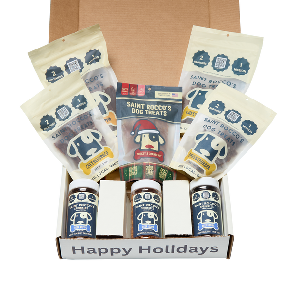 Box of Saint Rocco's Dog Treats with various packages and a 'Happy Holidays' label.