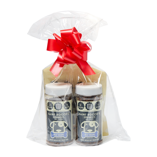Saint Rocco's Sprinkles Stocking Stuffer by Saint Rocco's Treats features two jars wrapped in clear plastic with a big red bow, creating a charming, gift-ready package—perfect for gifting gourmet dog sprinkles this holiday season.