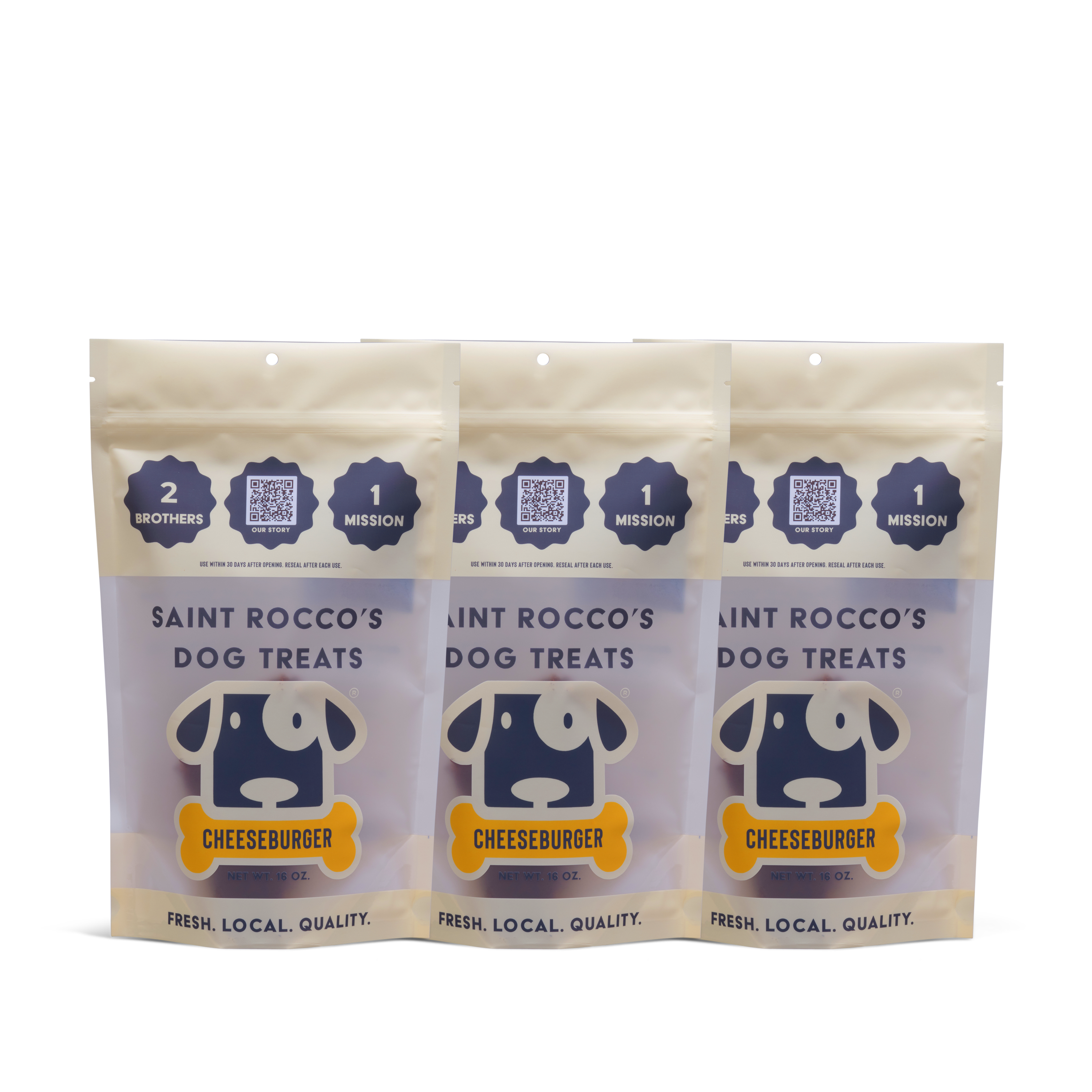 Three standing pouches of Saint Rocco’s Treats Cheeseburger Treats, featuring cartoon dog faces and “Fresh. Local. Quality.” labels on a white background.
