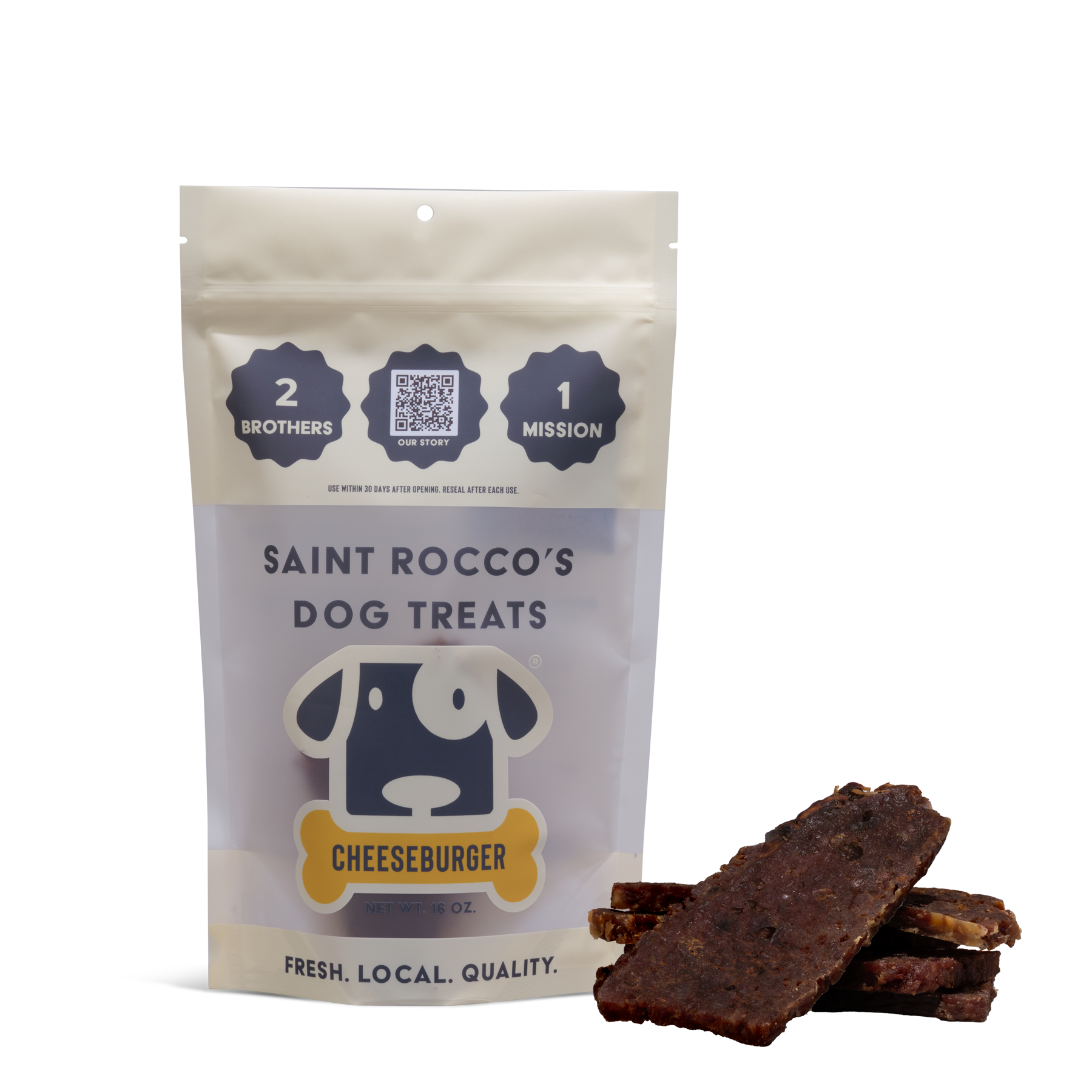 A beige and white bag labeled “Saint Rocco’s Treats Cheeseburger Treats” stands upright next to stacked, rectangular artisan dog treats. The packaging features a cartoon dog face and highlights freshness, quality, and high value.