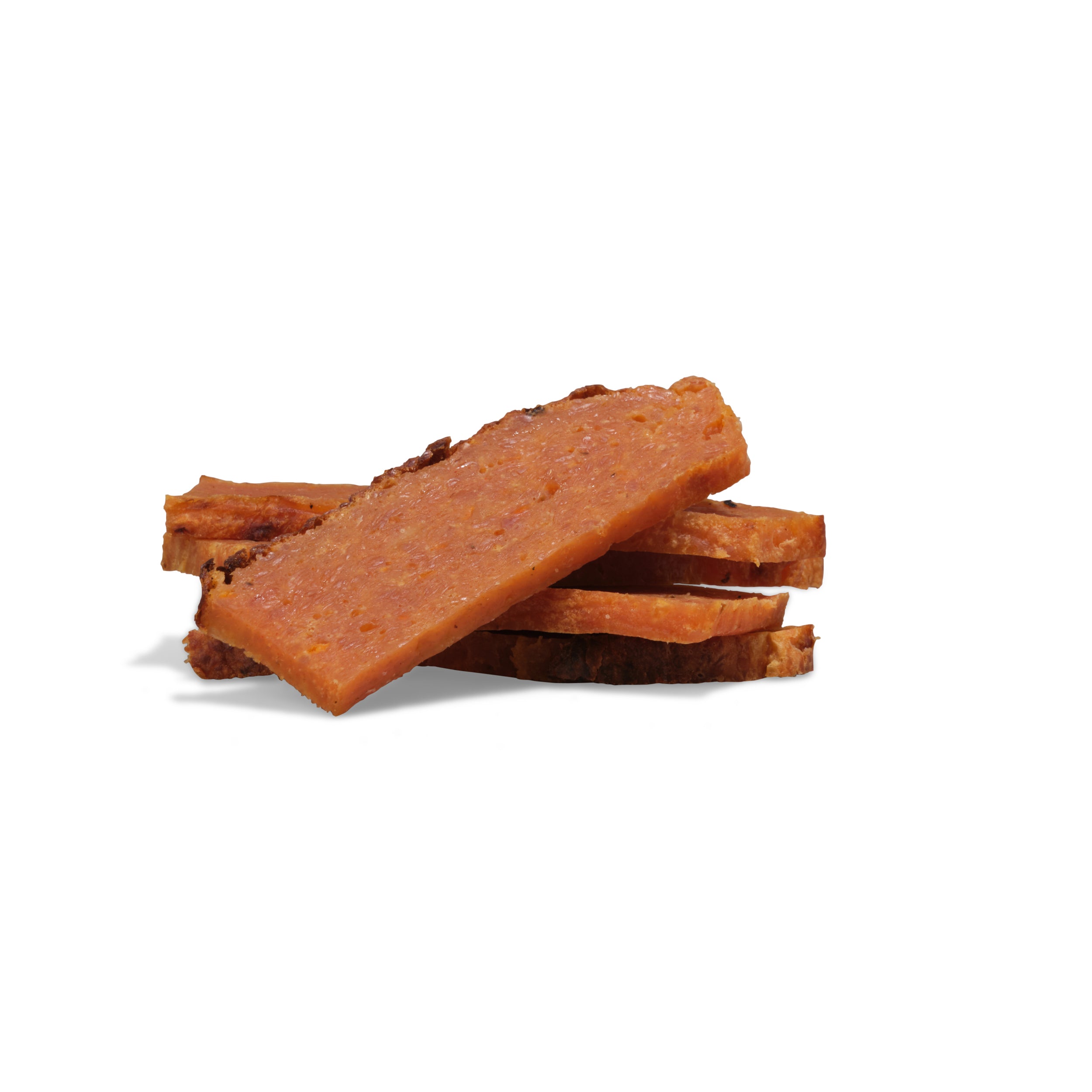 Several slices of Saint Rocco's Treats' Specialty Treats Bundle are stacked on a white background, resembling artisanal dog treats for your pup.