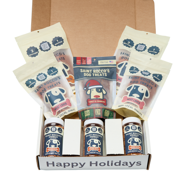 Dog treat packaging with 'Happy Holidays' text on a white background