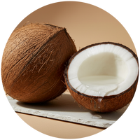 Coconut with one half cut open on a wooden surface