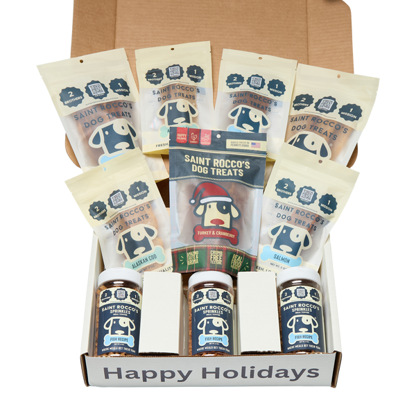 Box of Saint Rocco's Dog Treats with various flavors and a 'Happy Holidays' label.