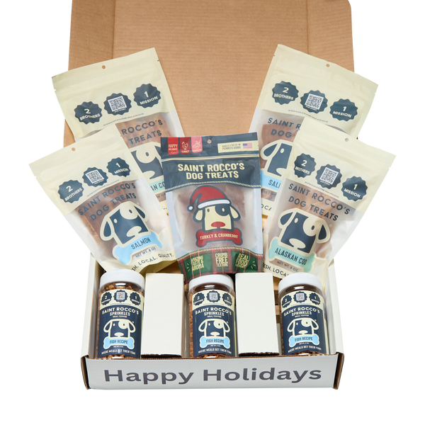 Box of Saint Rocco's Dog Treats with various flavors and a 'Happy Holidays' message.