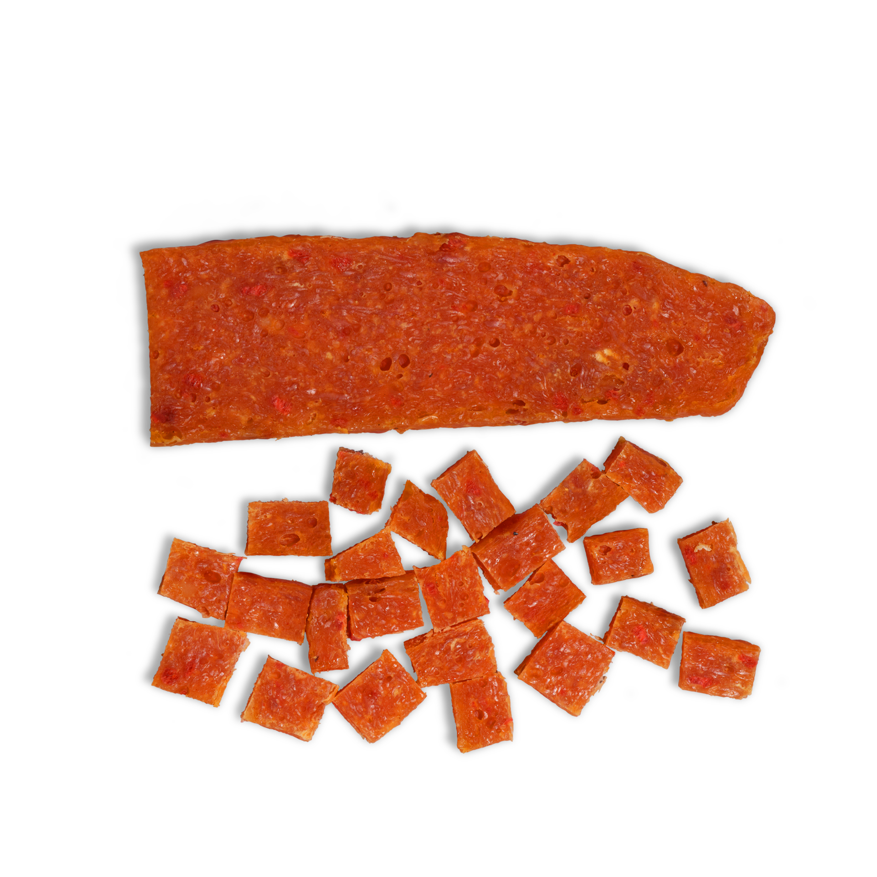 A large rectangular Meat Lover Treat from Saint Rocco's Treats sits above several small, square-cut pieces of the same jerky on a white background—perfect for dogs who love meaty treats.