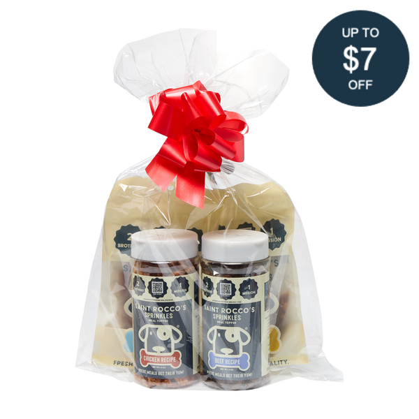 Saint Rocco's Sprinkles Stocking Stuffer by Saint Rocco's Treats: a clear-wrapped gift set with two gourmet dog sprinkle jars and two yellow bags. Great as a holiday dog stocking stuffer! Includes circular label: Up to $7 off.