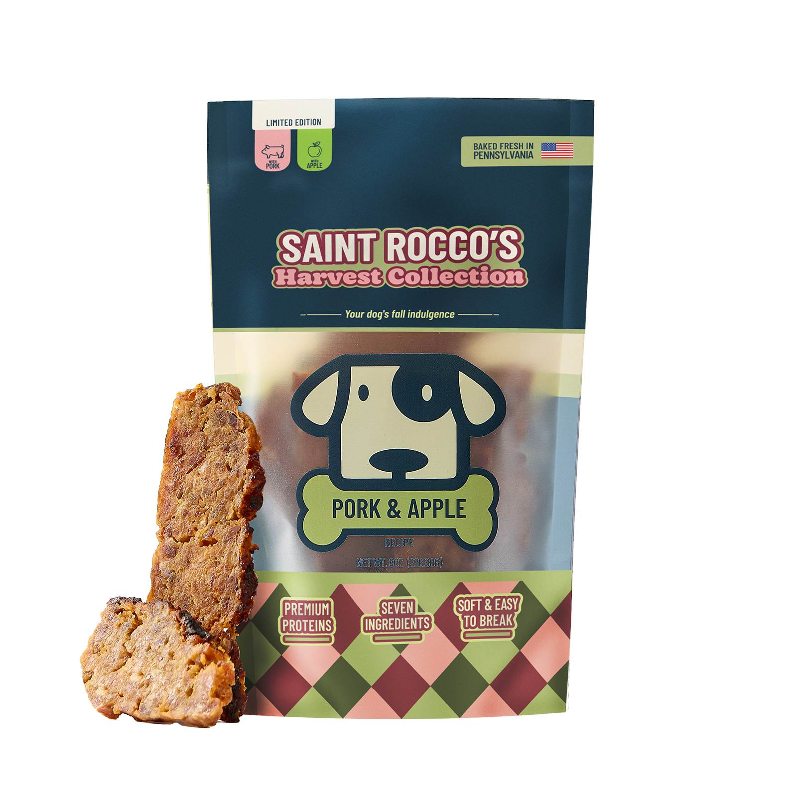 A stand-up pouch of Saint Rocco's Harvest Collection Pork & Apple dog treats, shown with two sliced treats leaning against the left side on a plain white background.