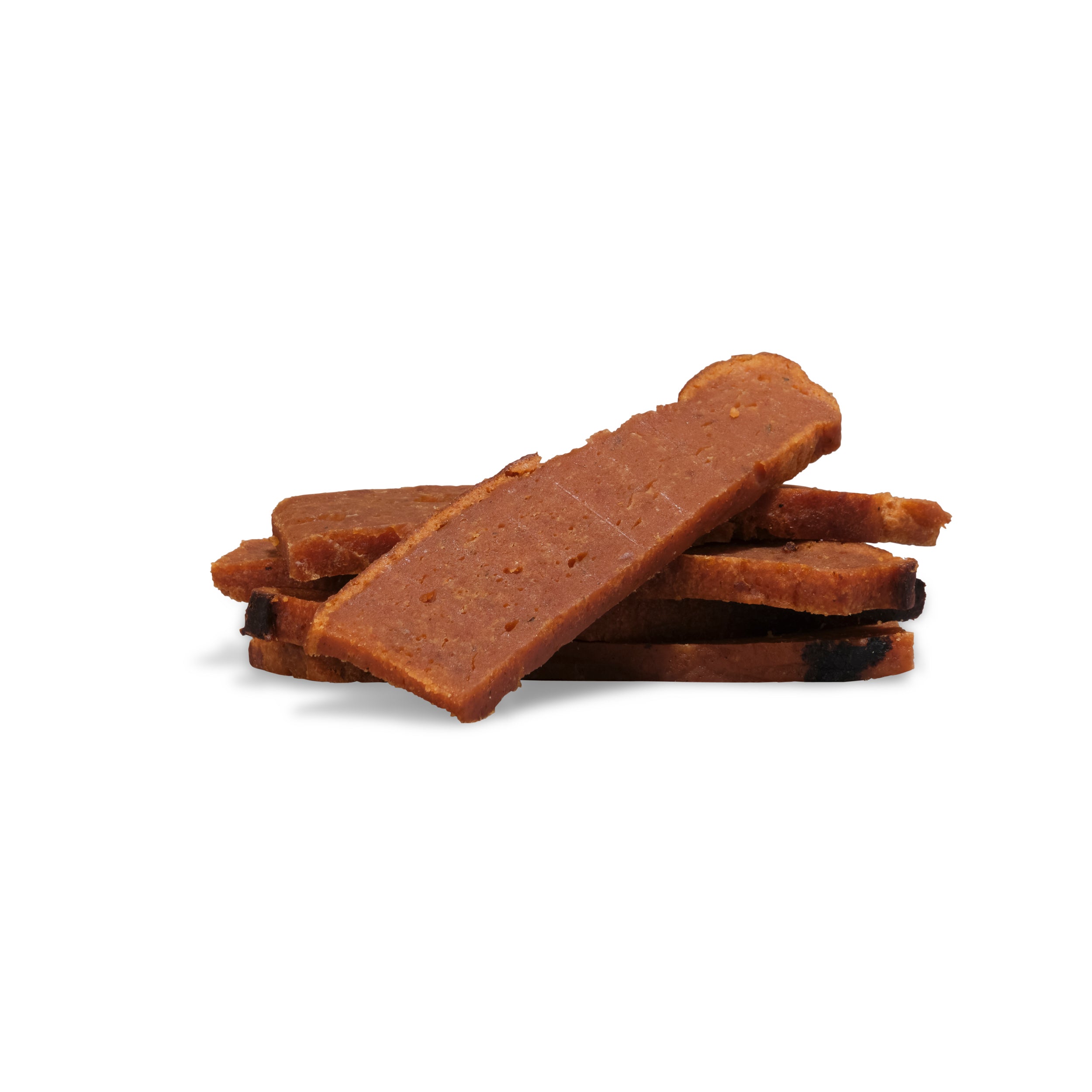 Four slices of cooked, rectangular meat with slight charring, stacked on white—ideal as high-value dog treats. Reward your pup with the Training Treats Bundle from Saint Rocco's Treats for training or special moments.
