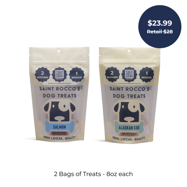 Saint Rocco's Treats Seafood Sampler Bundle: two 8oz bags of artisan dog treats—Salmon and Alaskan Cod flavors. Blue tag: $23.99 Retail $28. Text below: 2 Bags of Treats - 8oz each. Perfect seafood treats for your pup!.