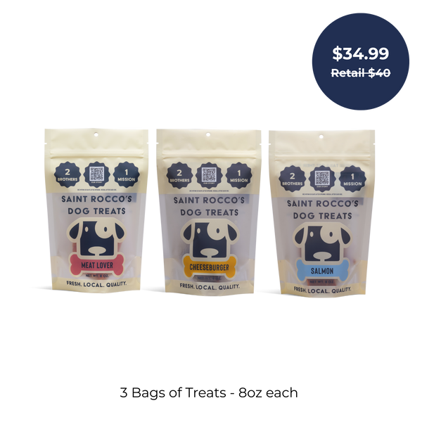 Saint Rocco's Treats Training Bundle: three 8oz bags in Meat Lover, Cheeseburger, and Salmon flavors. Blue circle features $34.99 (retail $40). Text below reads “3 Bags of Treats – 8oz each.”.