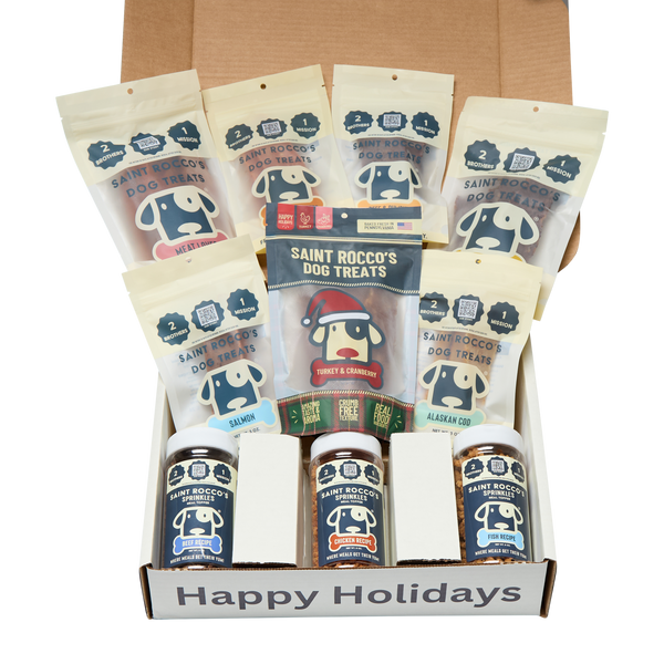 Box of Saint Rocco's Dog Treats with various treats and a 'Happy Holidays' message.